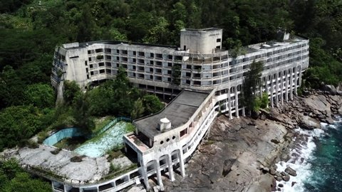 Aerial footage of Abandoned Mahe Beach hotel in Seychelles