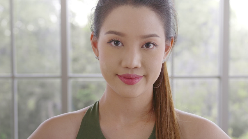 Portrait of fit young woman wearing sportswear at home, sport and healthy lifestyle concept.