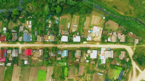 4K Aerial View Of Small Village. Houses And Vegetable Gardens. Potato Plantation At Summer Day. Village Garden Beds.