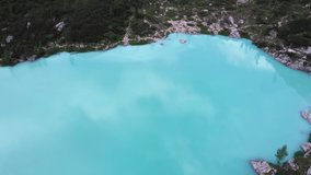 4K slow-moving drone footage of camera showing turquoise-coloured Lake Sorapis (Sorapissee) in mountains. Hiking, travelling, nature wonders concept.