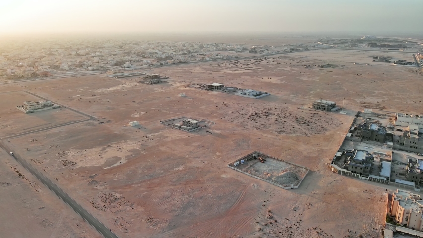 Doha, Qatar: Aerial view of capital city of Qatar, outskirts of city with adjoining desert - landscape panorama of Arabian Peninsula from above, West Asia