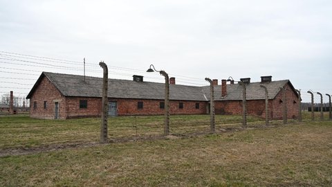 Auschwitz, Poland, March 2022: Auschwitz concentration and extermination camp. Nazi death camp. Barbered wire and barracks. 