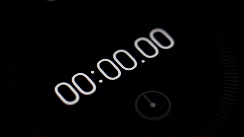 Close-up of the black screen of digital stopwatch with white running numbers. Time lapse 1 minute Royalty-Free Stock Footage #1089111895