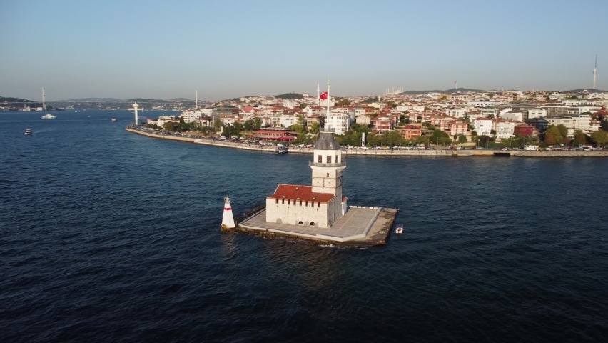 Awesome aerial view of the Maiden's Tower (Leander's Tower) and the Bosporus in Istanbul, Turkey. Drone flying over the Bosporus. Istanbul is a popular tourist destination in the world. Royalty-Free Stock Footage #1089112359