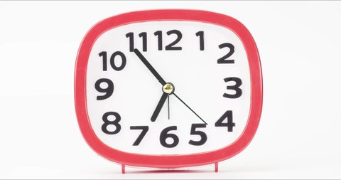 Red Alarm clock isolated on white background, Showtime 06.54 am or pm, Second-hand minute Walk Time concept.
