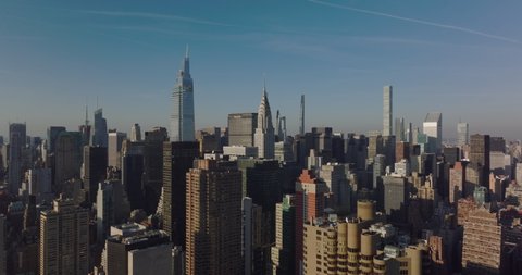 Elevated view of midtown towers. Heading to iconic Chrysler building with tall spire. Manhattan, New York City, USA in 2021