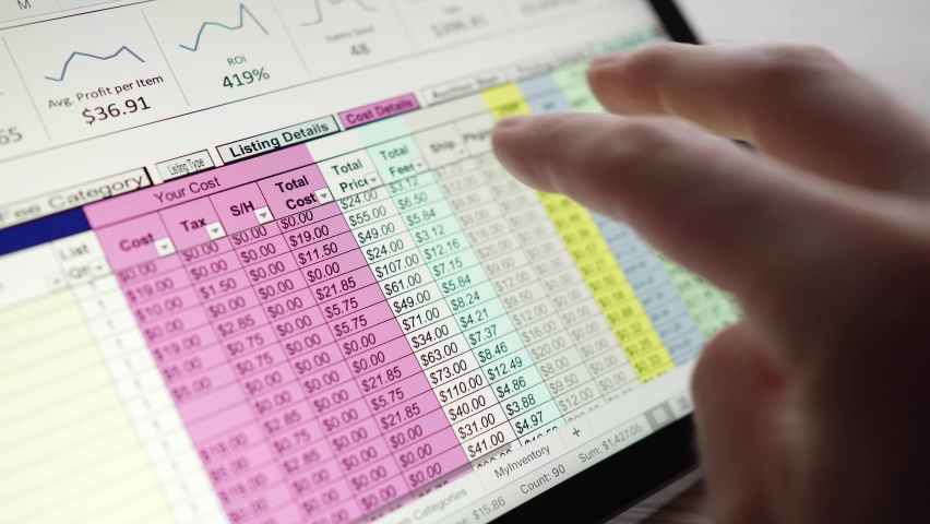 Closeup of an accountant working on a spreadsheet on a tablet display Royalty-Free Stock Footage #1089125529