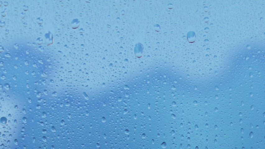 Rainy day, water drops in window with dark evening time, 4K.