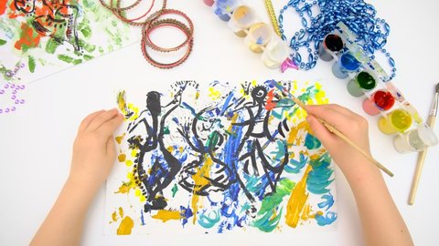 Child creativity. Painting with mixed media with abstract lines paints, abstract silhouettes dancing girls in an Indian costume, freehand lines 