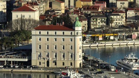 SPLIT, CROATIA - January 16 2022: Steady drone aerial video of the Harbour Master's Office in the old town at sunset.