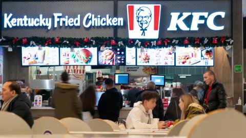 People eat in KFC catering restaurant, timelapse. Moscow, Russia - December 20, 2021.