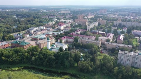 Scenic aerial view of Klin townscape with restored Orthodox Church of Resurrection on sunny summer day, Moscow Oblast, Russia. High quality 4k footage