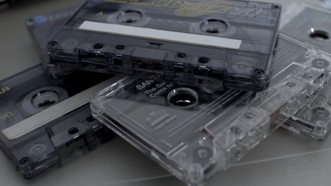 London , United Kingdom (UK) - 03 26 2022: Pile Of Old Music Cassette Tapes Being Removed One By One. Close Up, Locked Off Shot