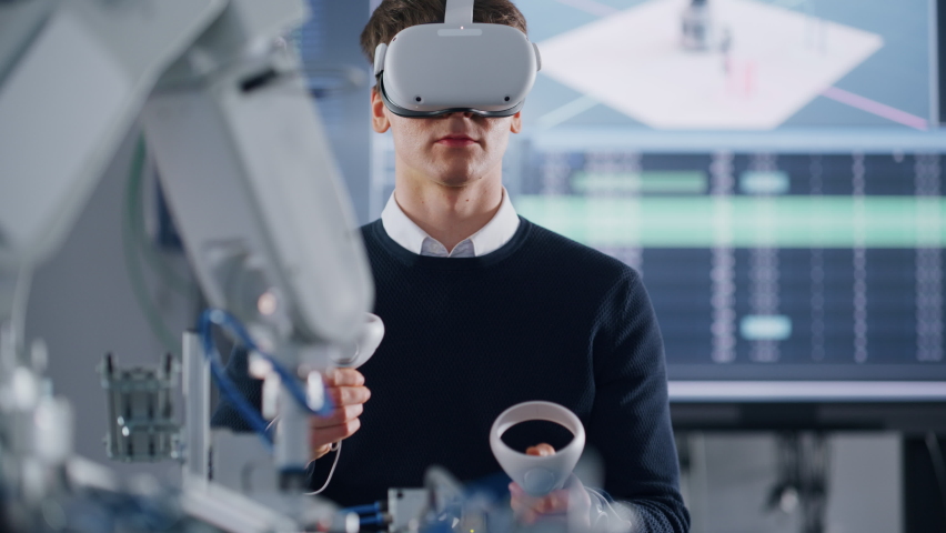 Student Developer Writing Code and Testing Interface of Bionic Hand. Engineer Wearing Virtual Reality Headset and Using Controllers at University. Virtual Reality Concept