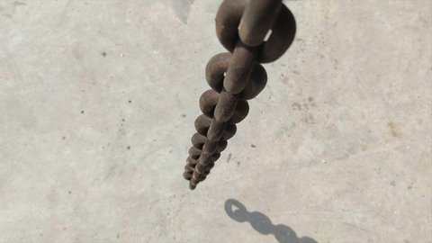 8K 7680x4320.Chain falling down.Chains flowing from top to bottom.Commercial footage at industrial job site.Metal industry product.Rusty iron and steel.Small chain rings big heawy long background awe.