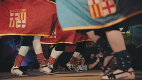 Barcelona, Spain; September 24th, 2021: Traditional Catalan Cavallets Cotoners horse figures in red and blue horse rugs with Barcelona coat of arms hopping in a popular Catalan dance.