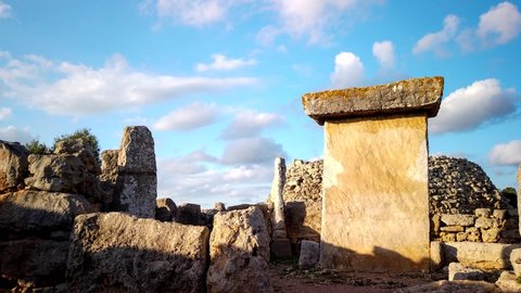 Timelapse of a megalithic structure in the Talayotic town of Trepucó on the island of Menorca, Spain. Clouds moving across the sky on a sunny day.	