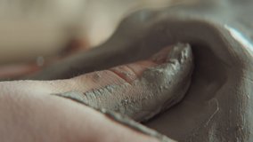 Close up shot of hands of unrecognizable sculptor modeling clay face - Powered by Shutterstock - Get 15% off with code: PIKWIZARD15