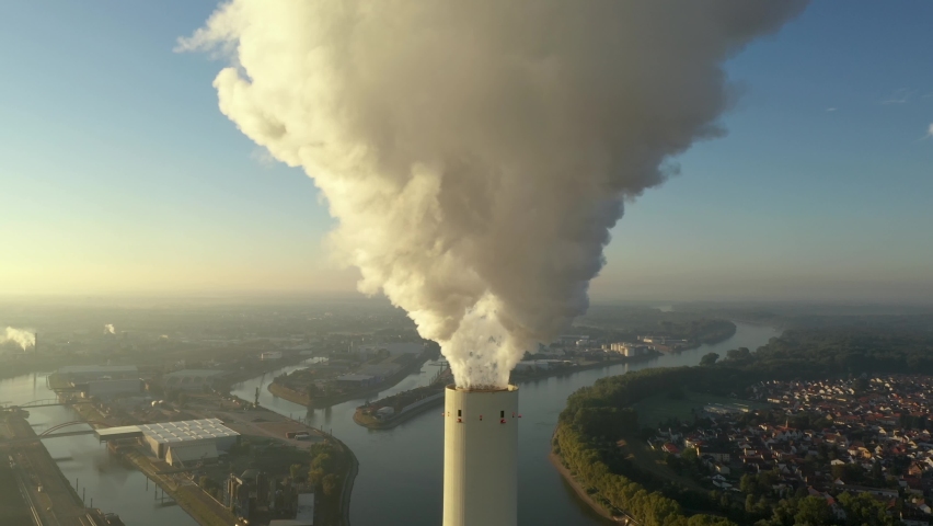 Dramatic smoke from a chimney, an industrial plant in city aerial view. Air pollution and global warming from a coal-fired power station.  and global warming. Close up and medium close shot. Royalty-Free Stock Footage #1089142051