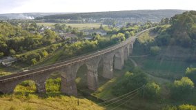 Spectacular ancient Austrian viaduct on a summer day. Footage from a bird's eye view. Location place Ukraine, Europe. Cinematic drone shot. Filmed in UHD 4k video. Discover the beauty of earth.
