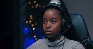 Close up shot of girl's face broken down sad because she loses in video game, screams through headset to team members grabbing head, virtual emotional world.