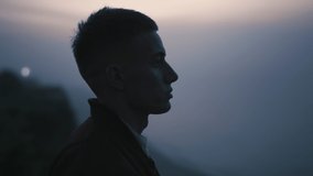 Portrait of peaceful man looking picturesque mountain landscape. Closeup dreamy guy standing on rock in foggy morning. Male person enjoying autumn nature at sunrise. Harmony with nature concept - Powered by Shutterstock - Get 15% off with code: PIKWIZARD15