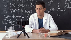 Arab chemist blogger writing blog video, teaching videos for students of chemistry, science and online education