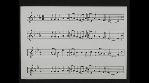 1960s: 4 musical staves with clefs, flats and various notes, one with a time signature