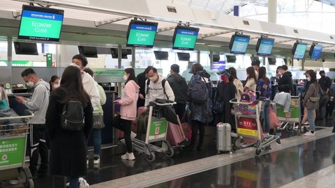 Hong Kong , Lantau Island , China - 02 20 2022: Passengers are seen at the check-in counter airline at the Chek Lap Kok International Airport in Hong Kong, China.
