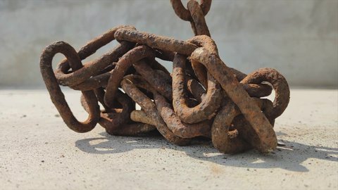 8K 7680x4320.Chain falling down.Chains flowing from top to bottom.Commercial footage at industrial job site.Metal industry product.Rusty iron and steel.Small chain rings big heavy long background awe.
