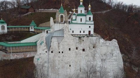 Aerial view from drone of Chalk St. Nicholas Church of Sviatohirsk Lavra, Sviatohirsk, Donetsk oblast, Ukraine. Outside view of monastic cells in chalk mountains of Sviatohirsk Cave monastery