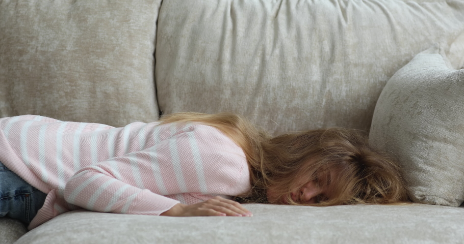 Close up young 30s woman falls on sofa at home, looks squeezed like lemon, feeling tired after hard working or party night, having wearisome day, need rest. Exhaustion relieve, bored weekend concept | Shutterstock HD Video #1089159117