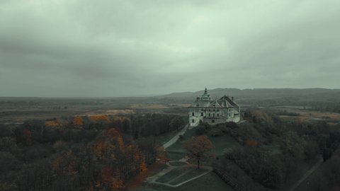 aerial view drone flight around of Old fairytale castle on the hill in Ukraine. Olesko Castle from above, Lviv district, Ukraine. Aerial video. Fortification sights of Ukraine