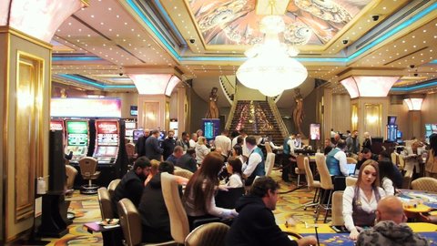 Batumi, Adjara, Georgia - 03.14.2022: Las Vegas Casino background. Slots. Poker. Players.