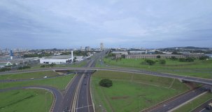 Aerial footage of Ribeirao Preto ring road ring during the day. Cars moving during overcast day. Brazil