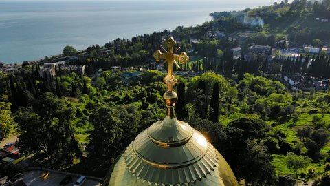 Drone view of the beautiful Orthodox New Athos Monastery with golden domes in the city of New Athos, Abkhazia. In the center of the temple complex stands the Panteleimon Cathedral