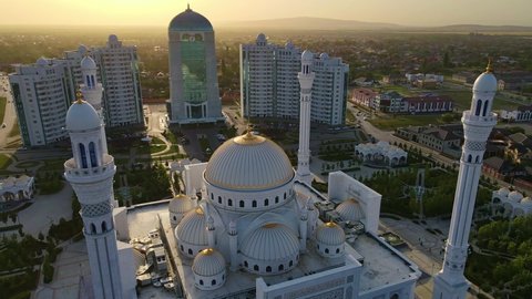 Mosque Pride of Muslims named after the Prophet Muhammad in Shali, Chechen Republic, Russia. Drone view. The largest mosque in Europe next to the Shali City high-rise complex