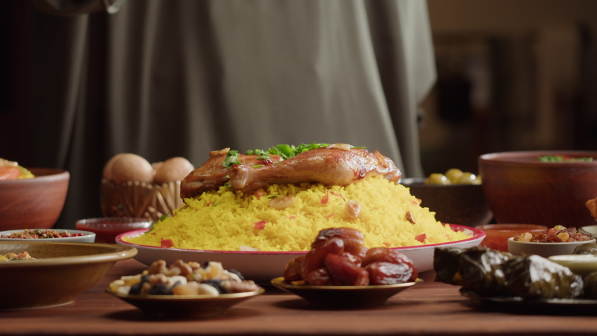 Couscous with chicken close-up, Muslim family dinner, Ramadan, iftar. Mediterranean and Arabian cuisine. Religious holiday, holy month. Worship and culture. Traditional Eastern Halal food. | Shutterstock HD Video #1089168273