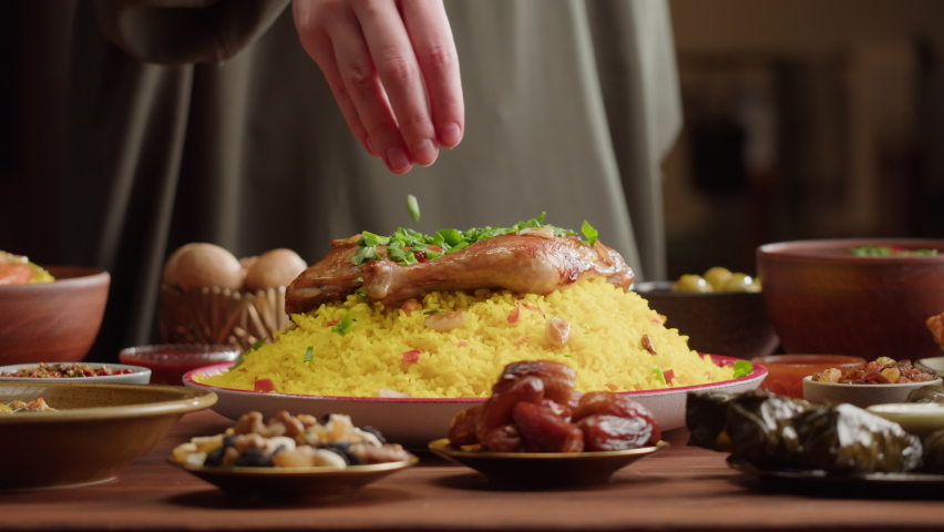 Couscous with chicken close-up, Muslim family dinner, Ramadan, iftar. Mediterranean and Arabian cuisine. Religious holiday, holy month. Worship and culture. Traditional Eastern Halal food. Royalty-Free Stock Footage #1089168273
