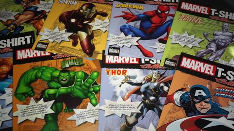 Rome, Italy - April 12, 2022, detail of Marvel comic book covers with datasheets inside, sold together with the t-shirts.