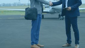 Animation of scopes and data processing over caucasian businessmen shaking hands and airplane. global business, travel and data processing concept digitally generated video.