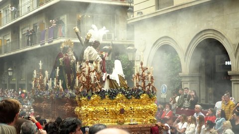 Granada Spain, April 11, 2022. Holy week procession with Jesus Christ carrying the cross. Easter of resurrection. Costaleros carrying the weight of jesus. brotherhood of labor.