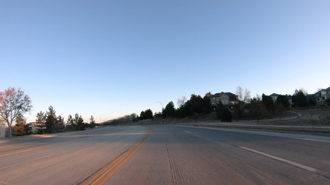 Denver, Colorado, USA-January 15, 2020 - Time lapse. Driving on typical paved roads in a suburban upscale residential neighborhood of America.