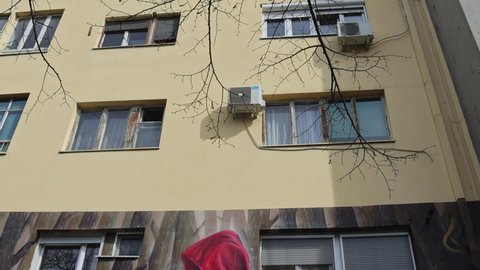 Belgrade, Serbia - April 01, 2022: Little Red Riding Hood Fairy Tale Mural at Street Name by Writers Brothers Grimm.
