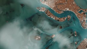 Aerial View of the Venetian Lagoon, showing many of the Islands including Venice itself, Satellite View. Elements of this Video furnished by NASA. 4K Resolution.