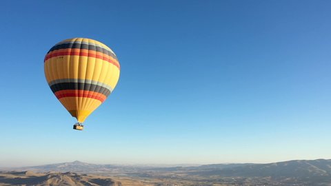 colorful hot air balloon is flying in the blue sky. beautiful blue sky background. Hot air balloon in cappadocia