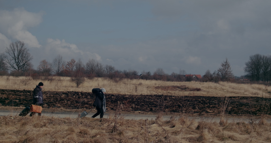 Immigrants Walking On Road During War Problems.