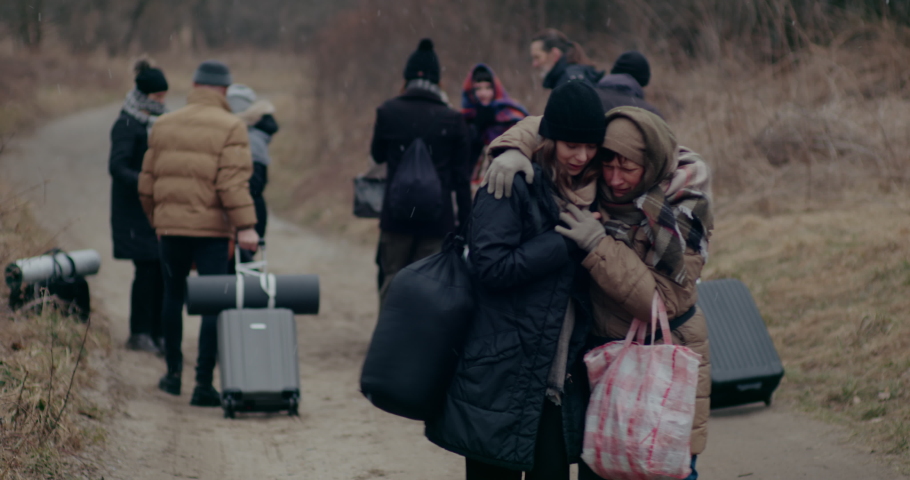 Refugee Woman Consoling Crying Daughter During War. Royalty-Free Stock Footage #1089199869