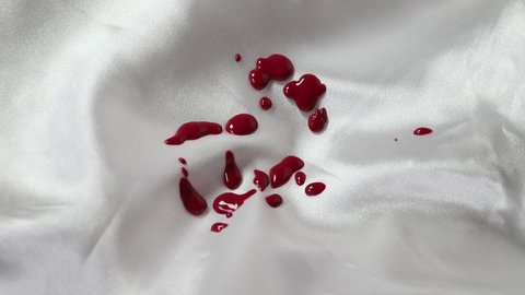 Blood drops on white cloth