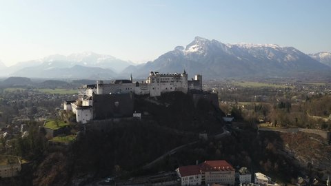Castle in Salzburg. Drone View. Snow mountains in the background.